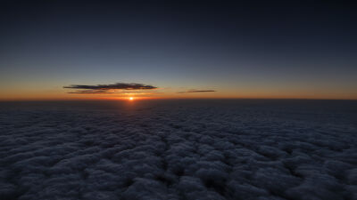 Sunset above the clouds 