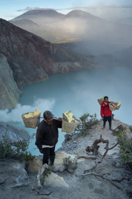 Local sulphur miners at the sulphur lake of Mt Ijen, East Java