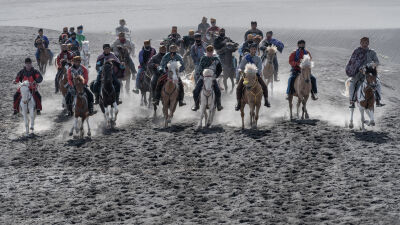 Horse race on the sand savanna of Mt Bromo, East Java