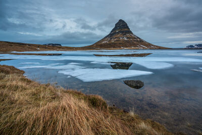 Kirkjufell mountain in West Iceland on a cold morning in winter