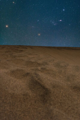 Orion's above sand dunes