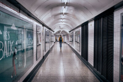 Pedestrians in the hallways of the London metro